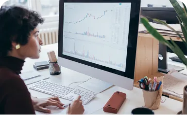 Woman viewing business data on computer