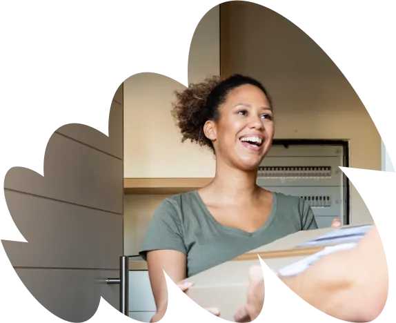 Woman smiling and receving delivery