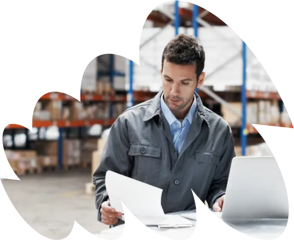 Man reading document in warehouse