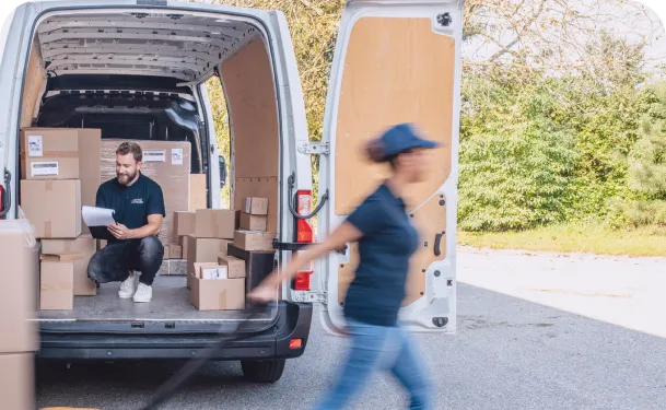 Delivery van with delivery man and woman