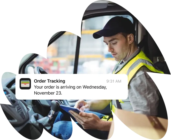 A man sitting in a car using a tablet.