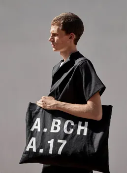 man carrying tote bag