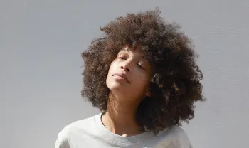 Woman with sun on her face