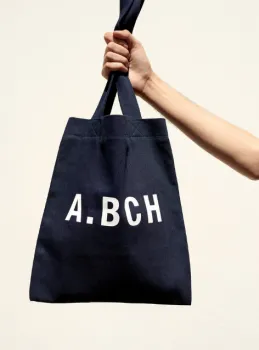 tote bag being held by hand
