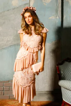 Woman wearing dress holding handbag