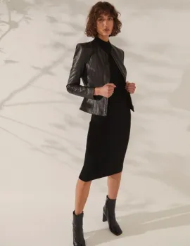 Woman wearing heels and a leather jacket