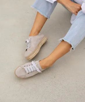 Woman from knee down wearing shoes