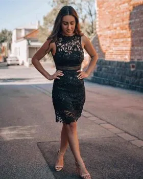 Lady standing in alleyway wearing dress