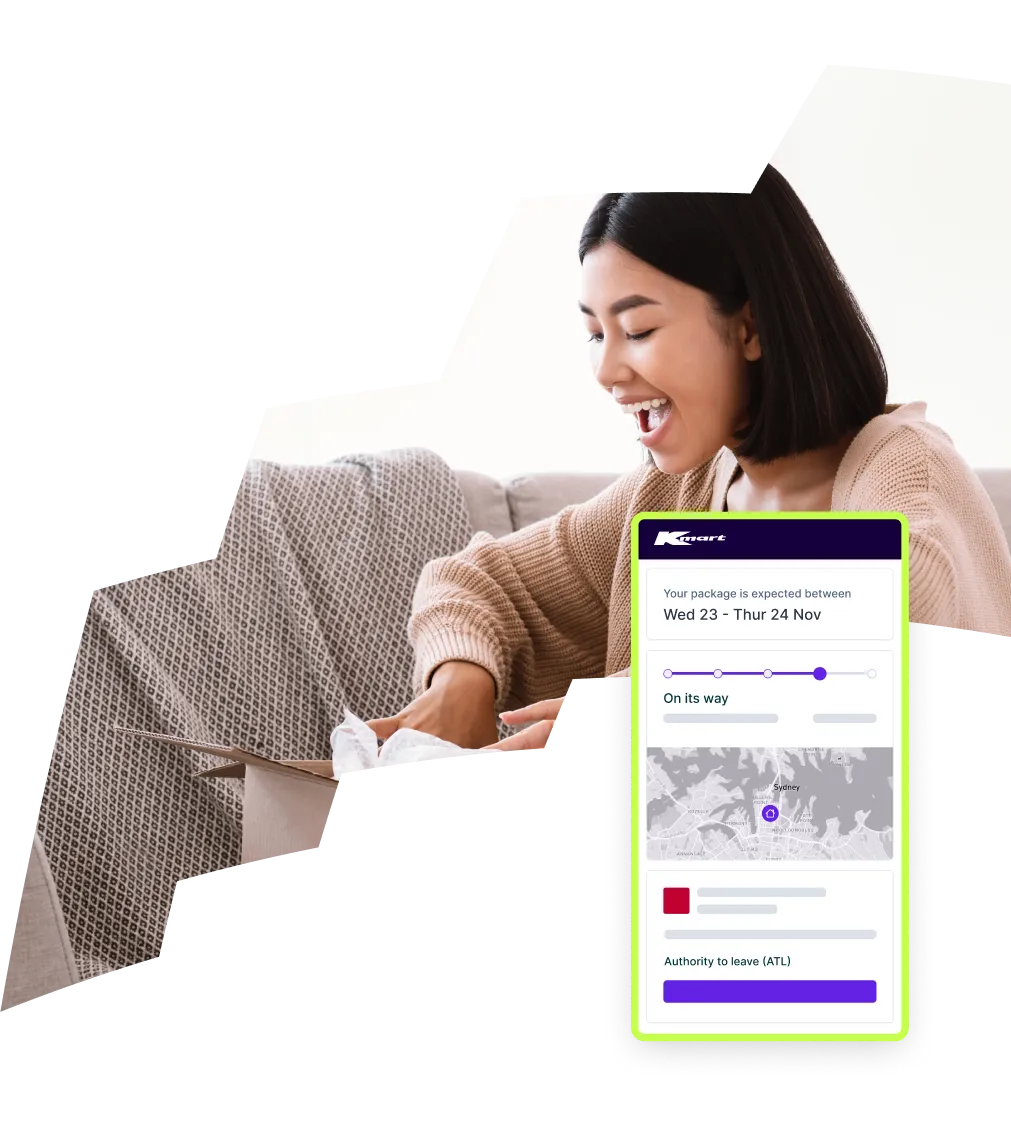 A woman smiling while checking a package delivery update on her device with a Kmart tracking notification displayed.