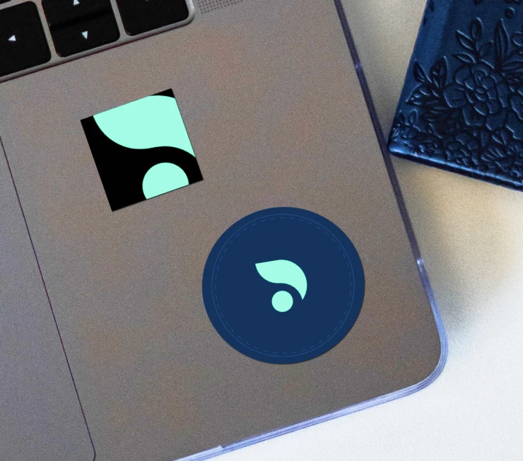 laptop with smoking dots logo stickers