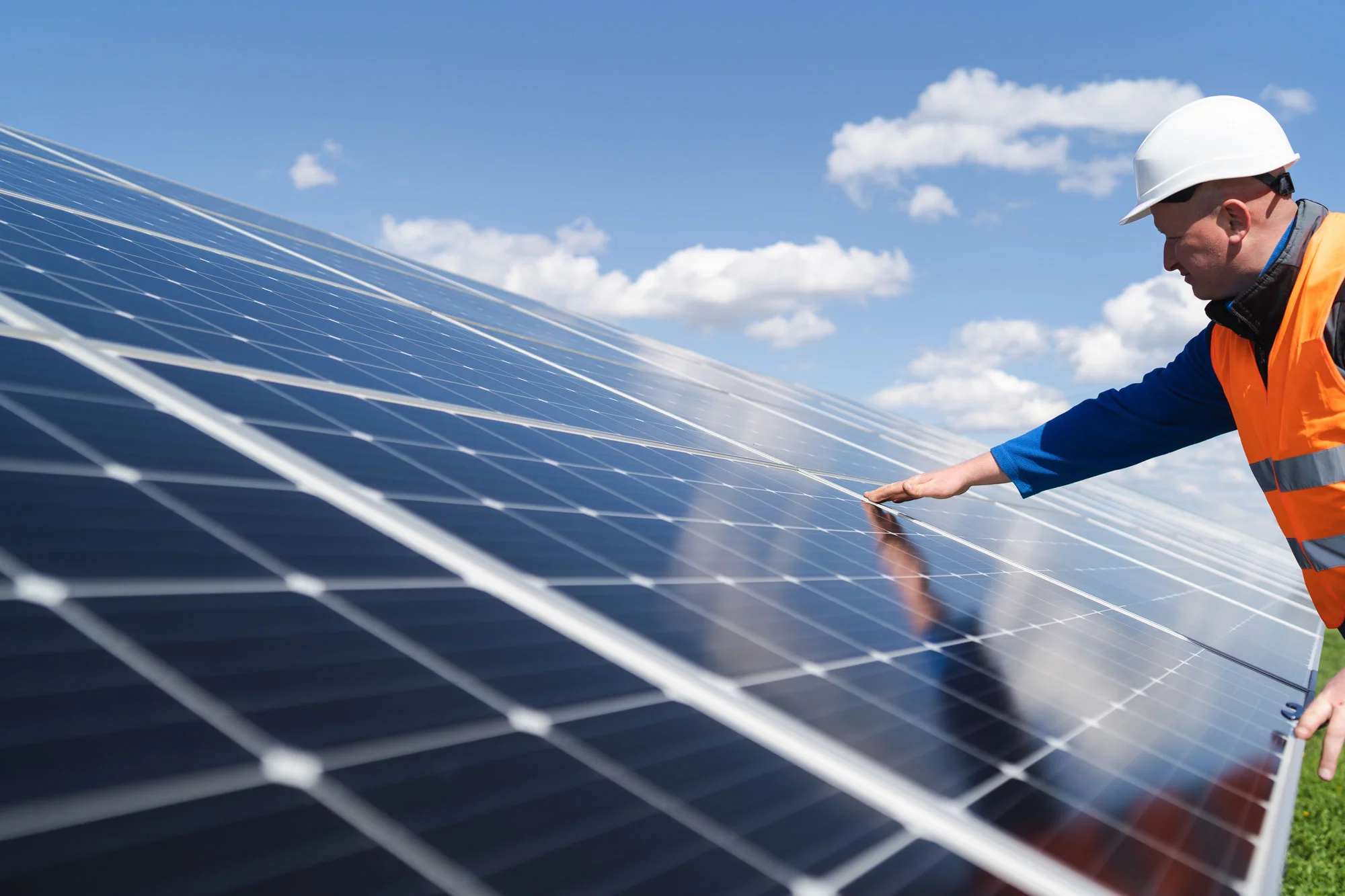 an engineer making an inspection to the solar plant
