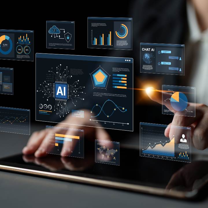 A person wearing glasses looks intently at a large screen displaying colorful data charts and graphs.