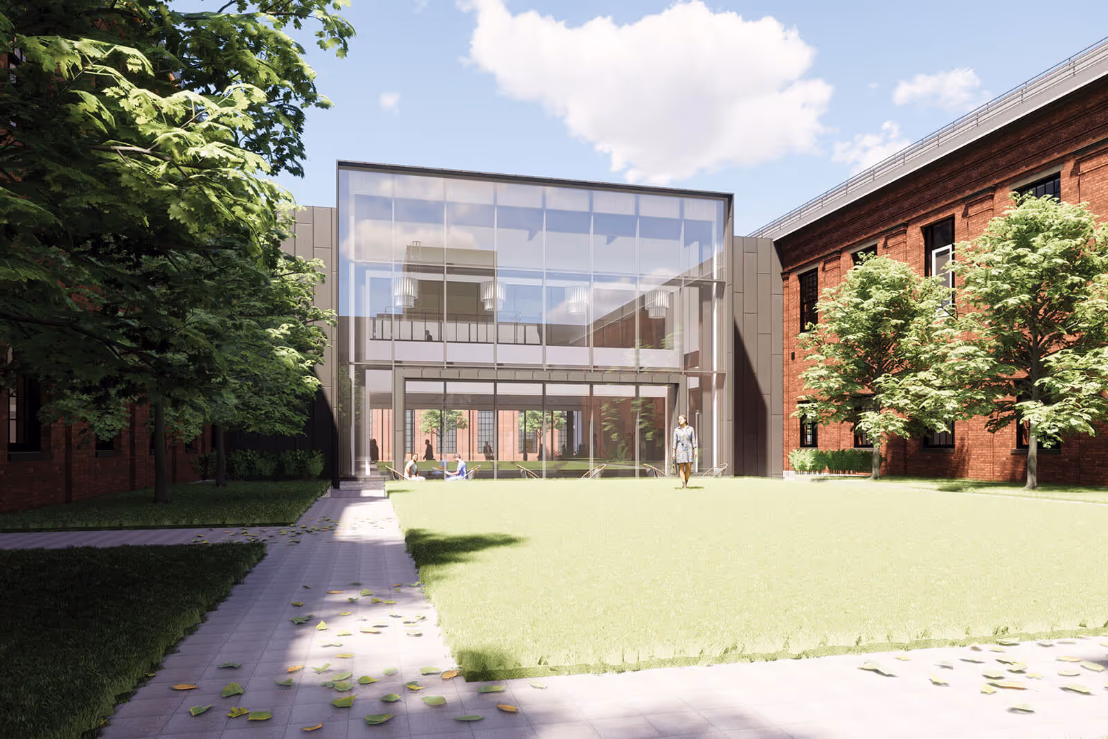 Modern glass building with green lawn and trees on sunny day