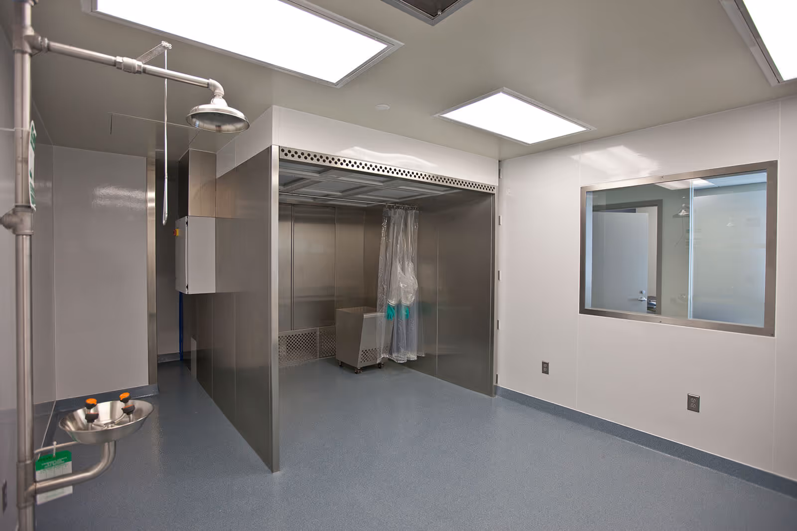 Clean medical decontamination shower room with stainless steel enclosure