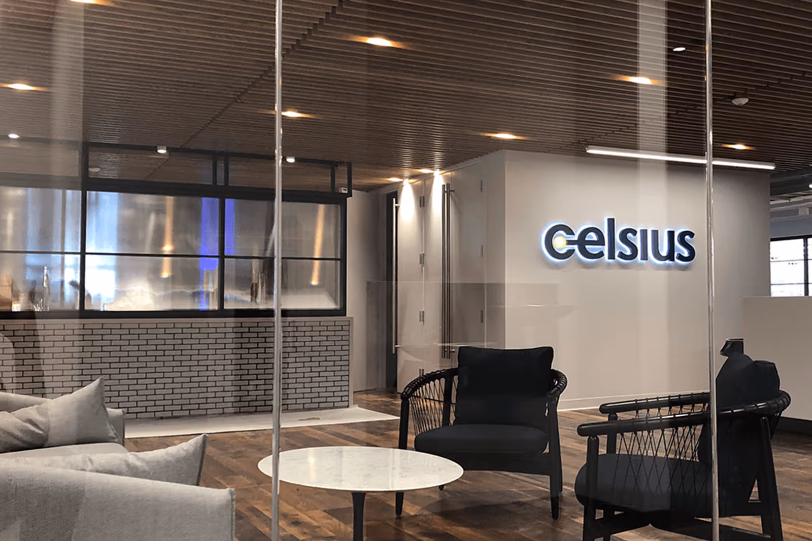 Celsius office interior with modern furniture, gray walls, and company logo
