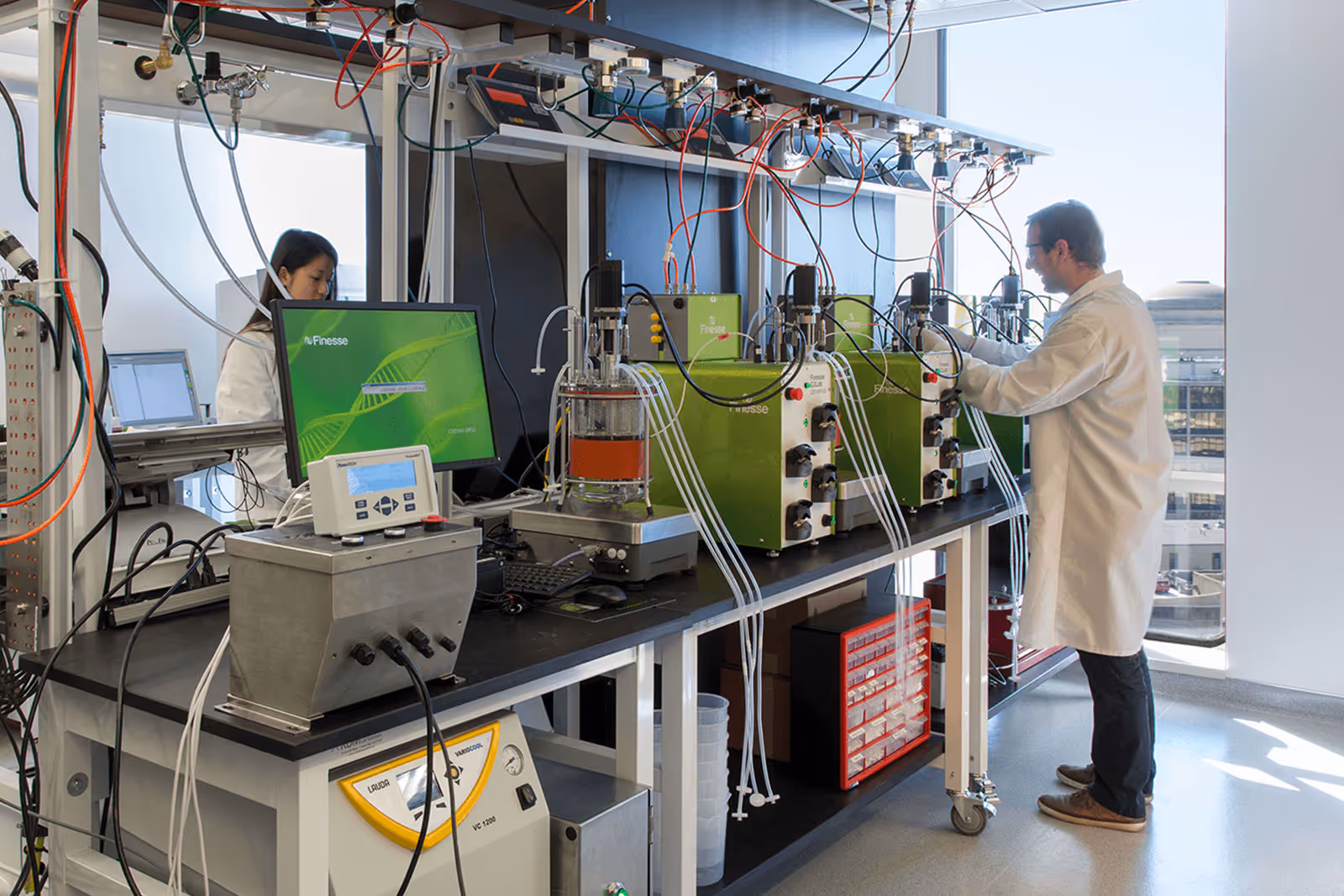 Scientists working in a high-tech laboratory with complex scientific equipment