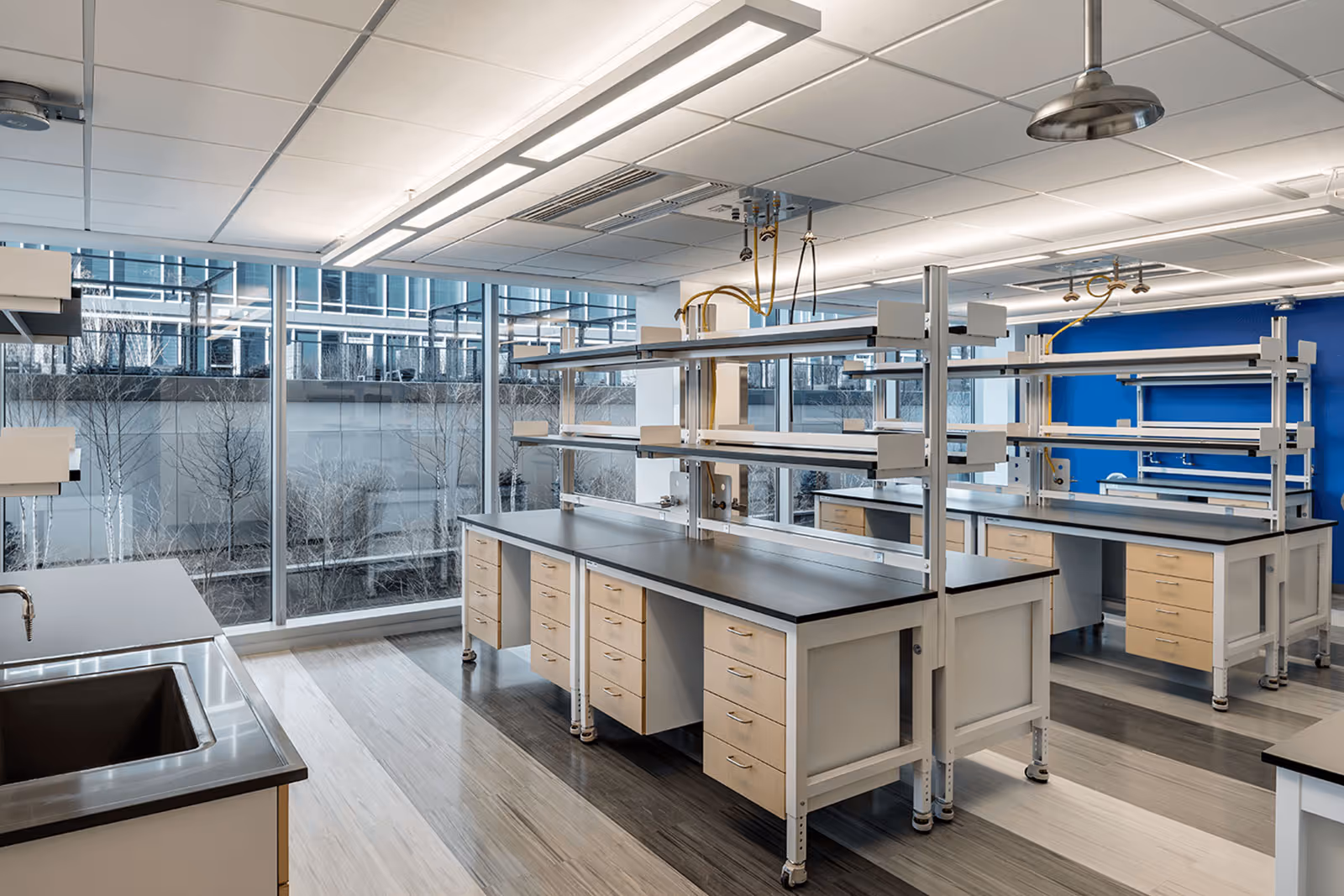 Modern, empty laboratory with large windows and modular workstations
