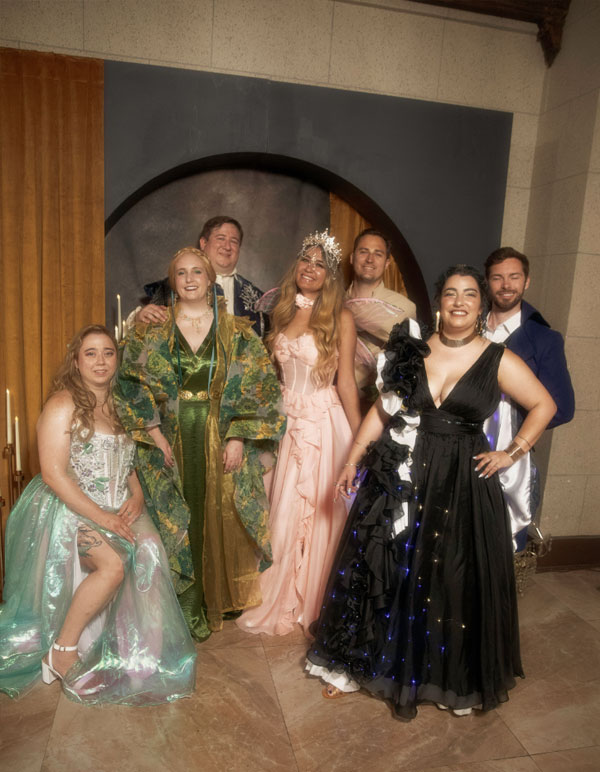 Guests of Paravelle Fantasy Events gather together to take a photo in front of one of the luxury backdrops at The Vanguard of Valor in Los Angeles Southern California Bookish Event