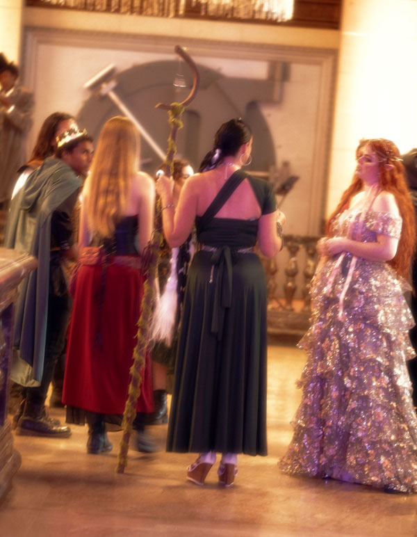 Immersive Theatre interactive characters talk to each other on the dance floor of The Majestic Downtown in Los Angeles for The Paravelle Ball Fantasy Experience