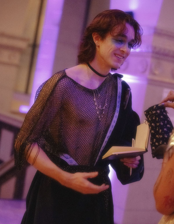 A god character from The Vanguard of Valor Immersive Fantasy Experience by The Paravelle Ball in Los Angeles talking to a guest