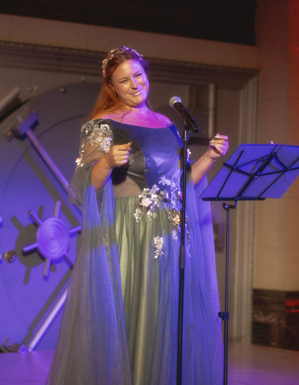 An opera singer takes the stage at The Paravelle Events Fantasy Experience in Los Angeles the Vanguard of Valor Heroes Ball in Southern California on the stage of The Majestic Downtown