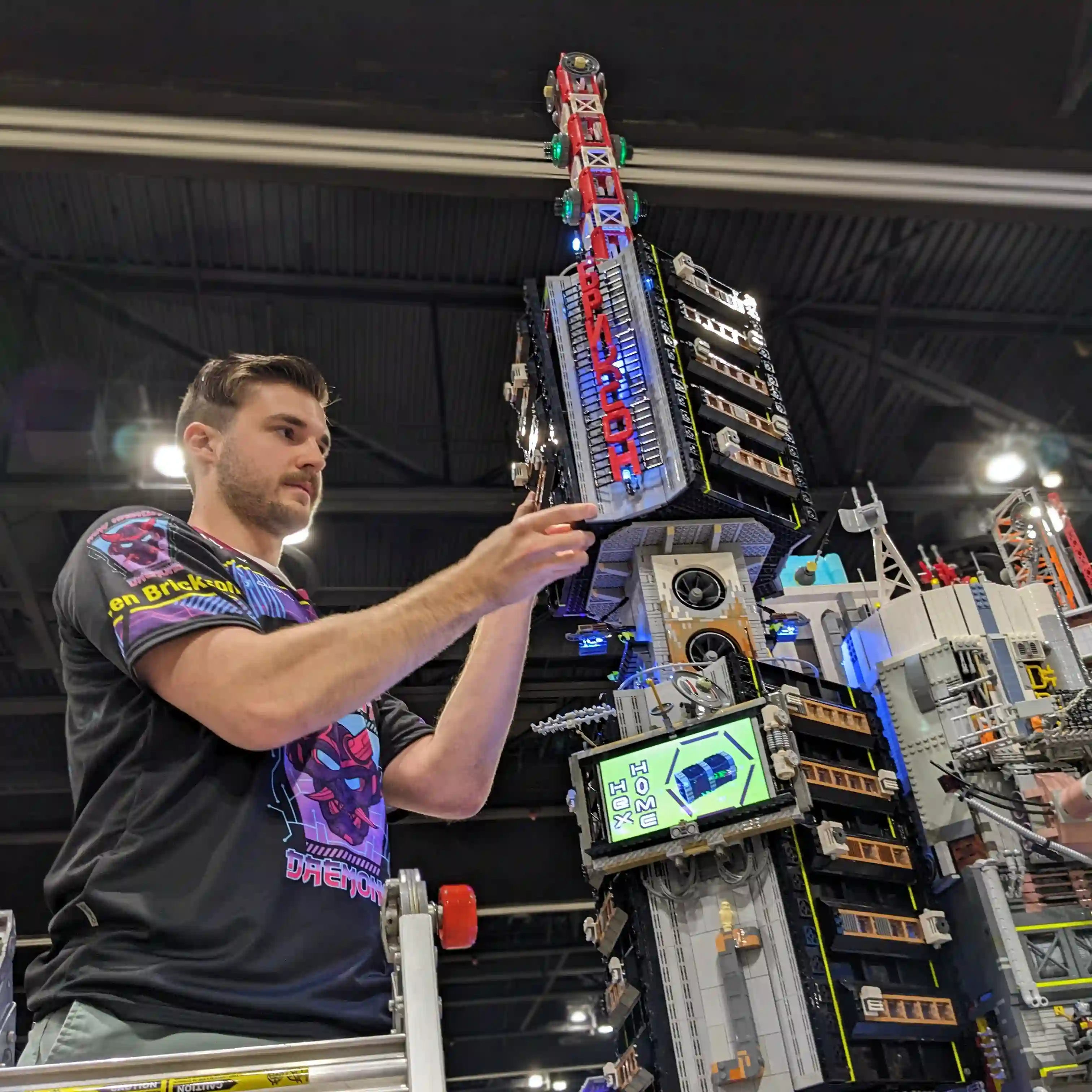 Ben Brickson working on his tower for the New Hashima collab at BrickWorld Chicago 2023