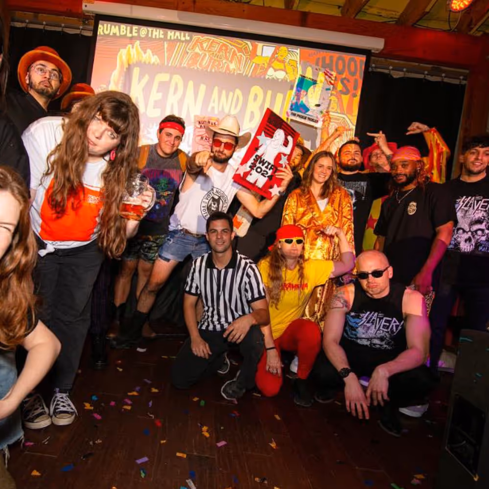 Group photo of attendees in costume at Kern and Burn 2024 Rumble at the Hall design competition.