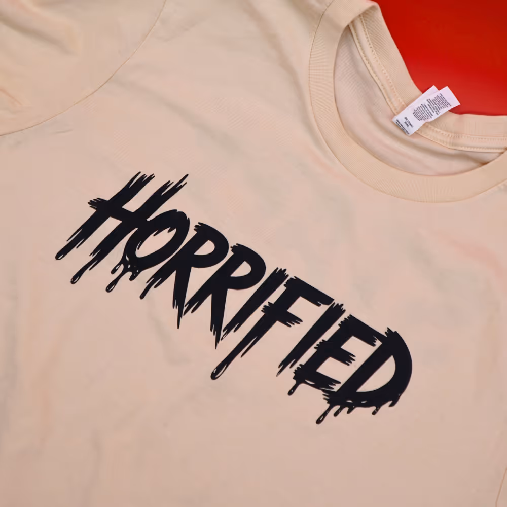 a tshirt with the word horrified screen printed in black