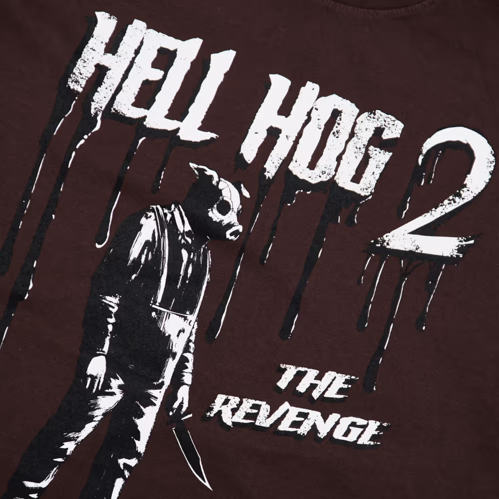 a brown shirt with a hell hog design in white and black 