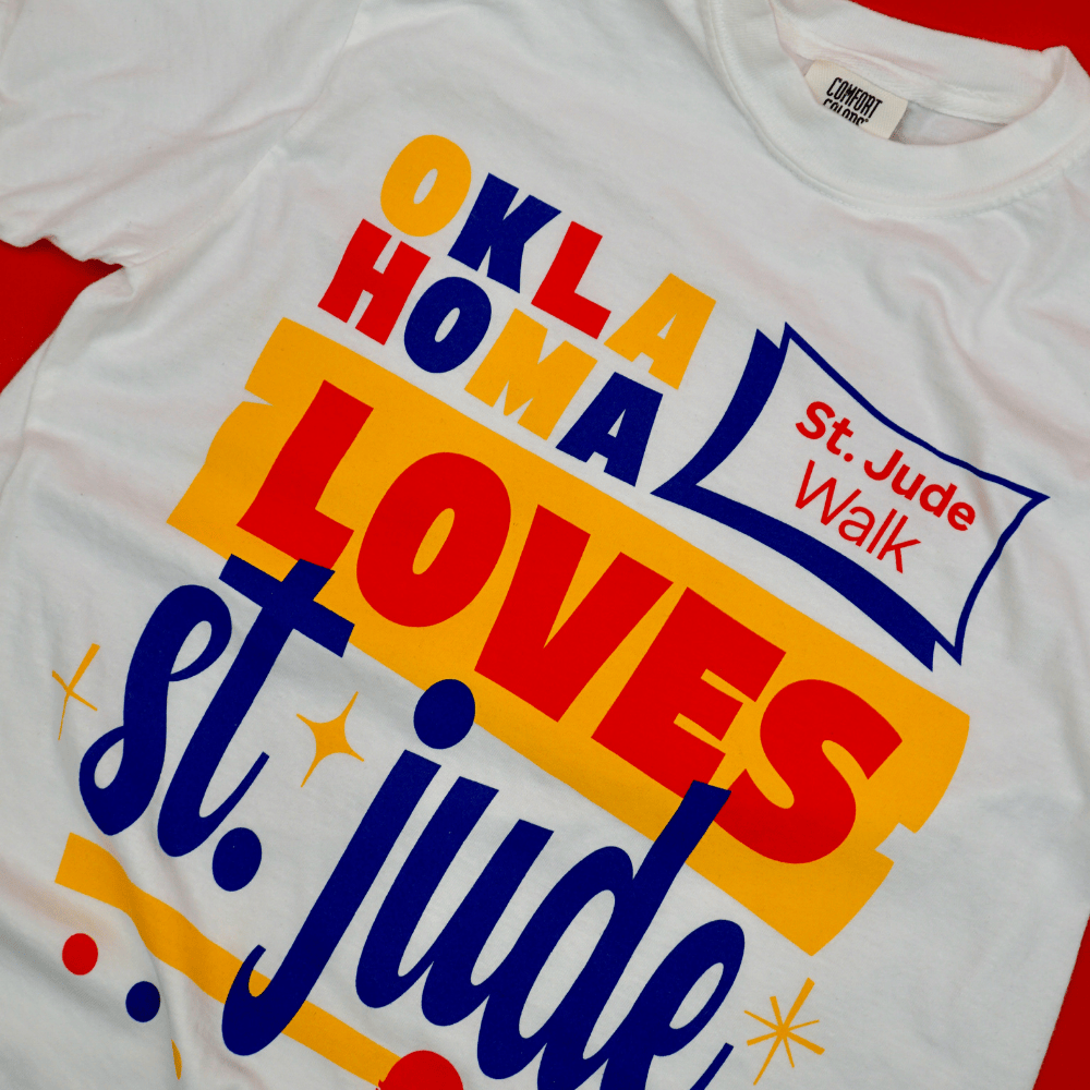 a white shirt that says Oklahoma Loves St. Jude