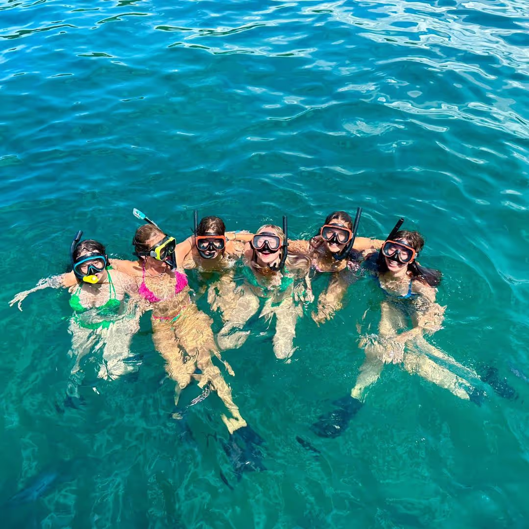 A group of young people from the Leap swimming in the sea in Costa Rica with snorkels and masks