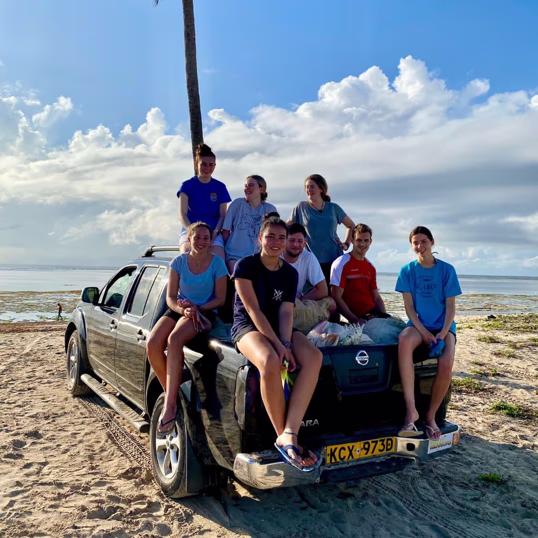 A group of young people from The Leap piled into a car on a beach in Costa Rica