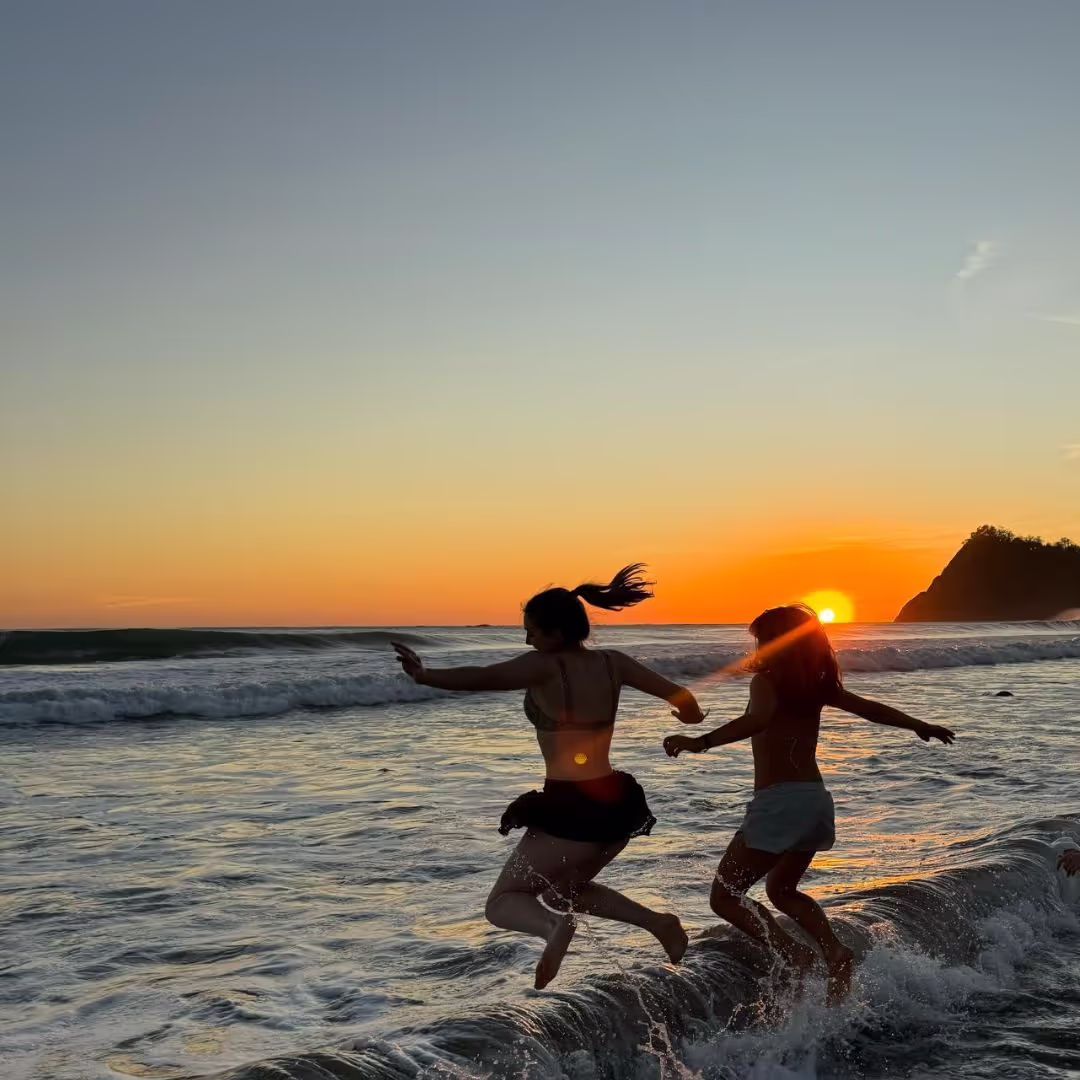 2 Gap Year adventurers from The Leap jumping into the sea