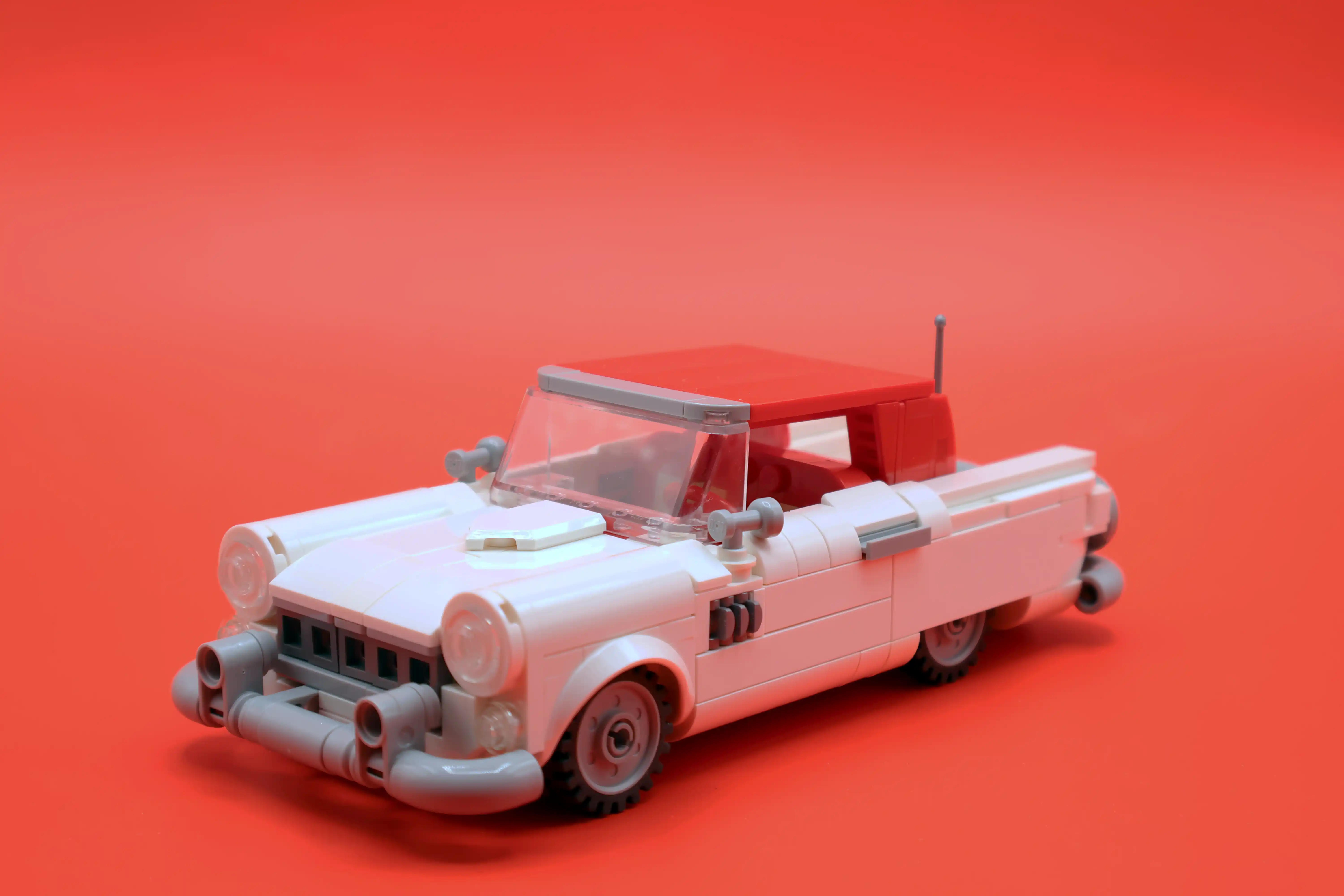 A custom LEGO commission by Ben Brickson of a white 1955Ford Thunderbird