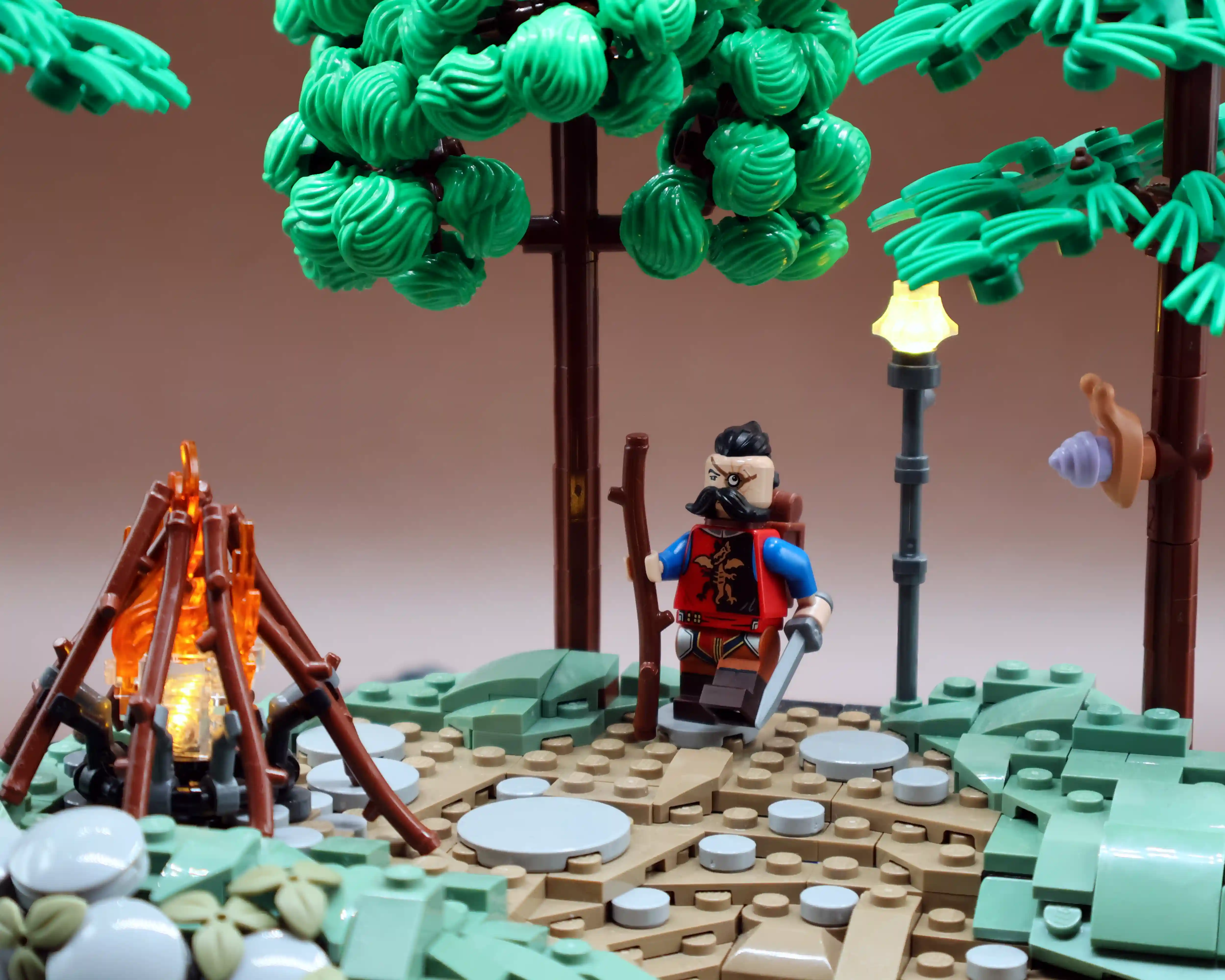 A small vignette build showcasing different LEGO tree techniques and telling the story of a deserting knight by a campfire.