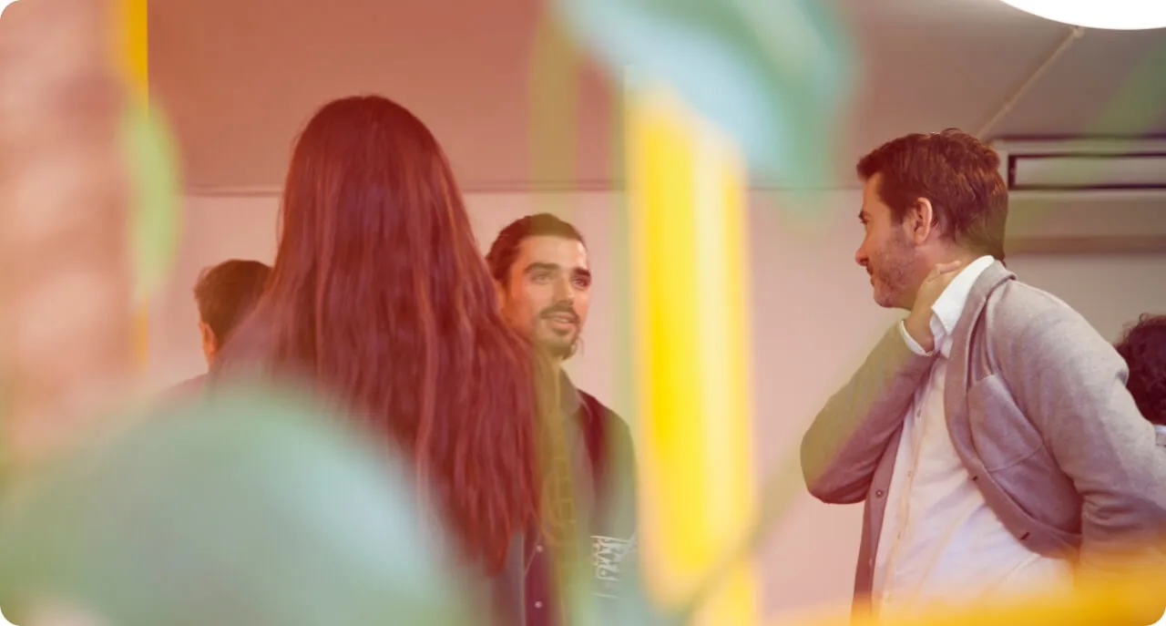 a man standing next to a woman in a room