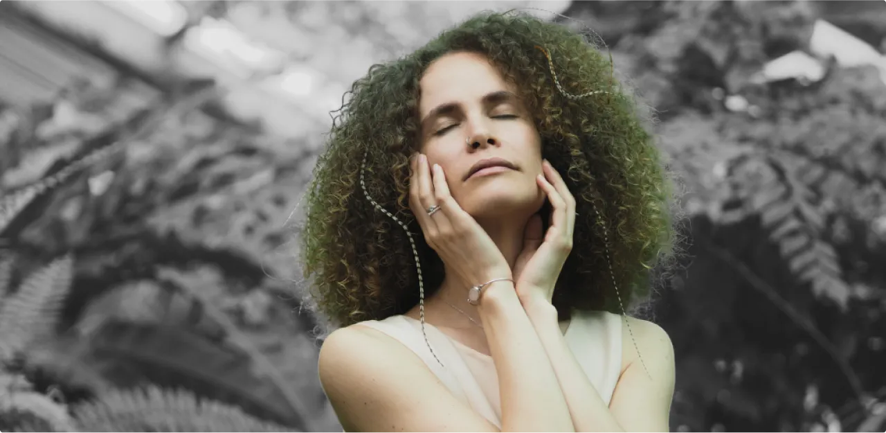 Woman imagining while eyes is closed