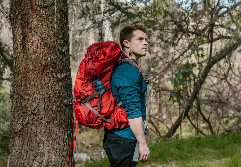 Man in the middle of the forest