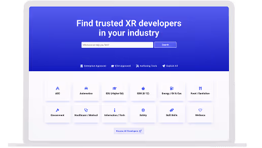 Laptop screen displaying a search interface to find trusted XR developers by industry, with industry category buttons like Automotive, Energy, Healthcare, and more.