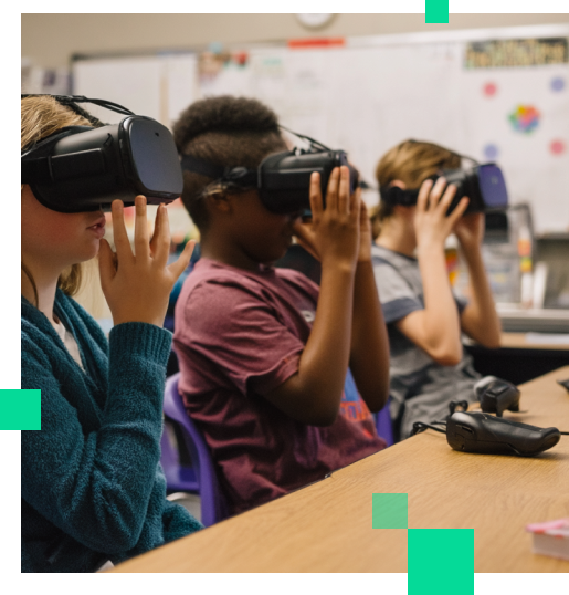 An image of three children in a classroom using VR headsets