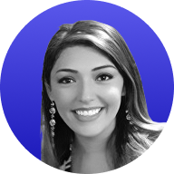 Smiling woman with long hair wearing earrings against a blue circular background.