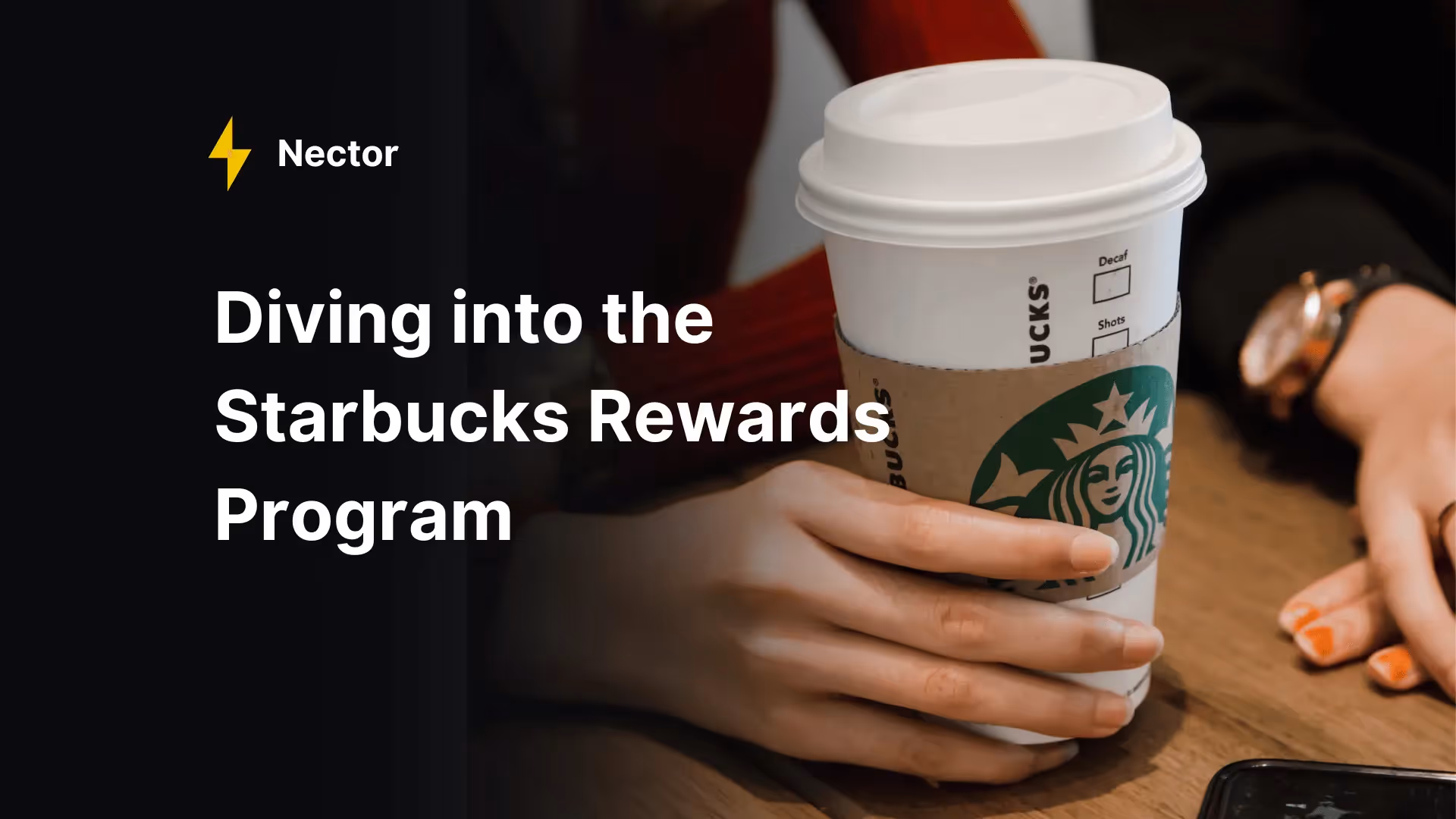 Person holding Starbucks coffee cup with Nector analysis of the Starbucks Rewards loyalty program