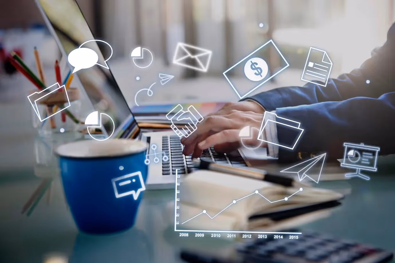 Hands typing on a laptop with floating icons representing email, marketing, analytics, and automation tools