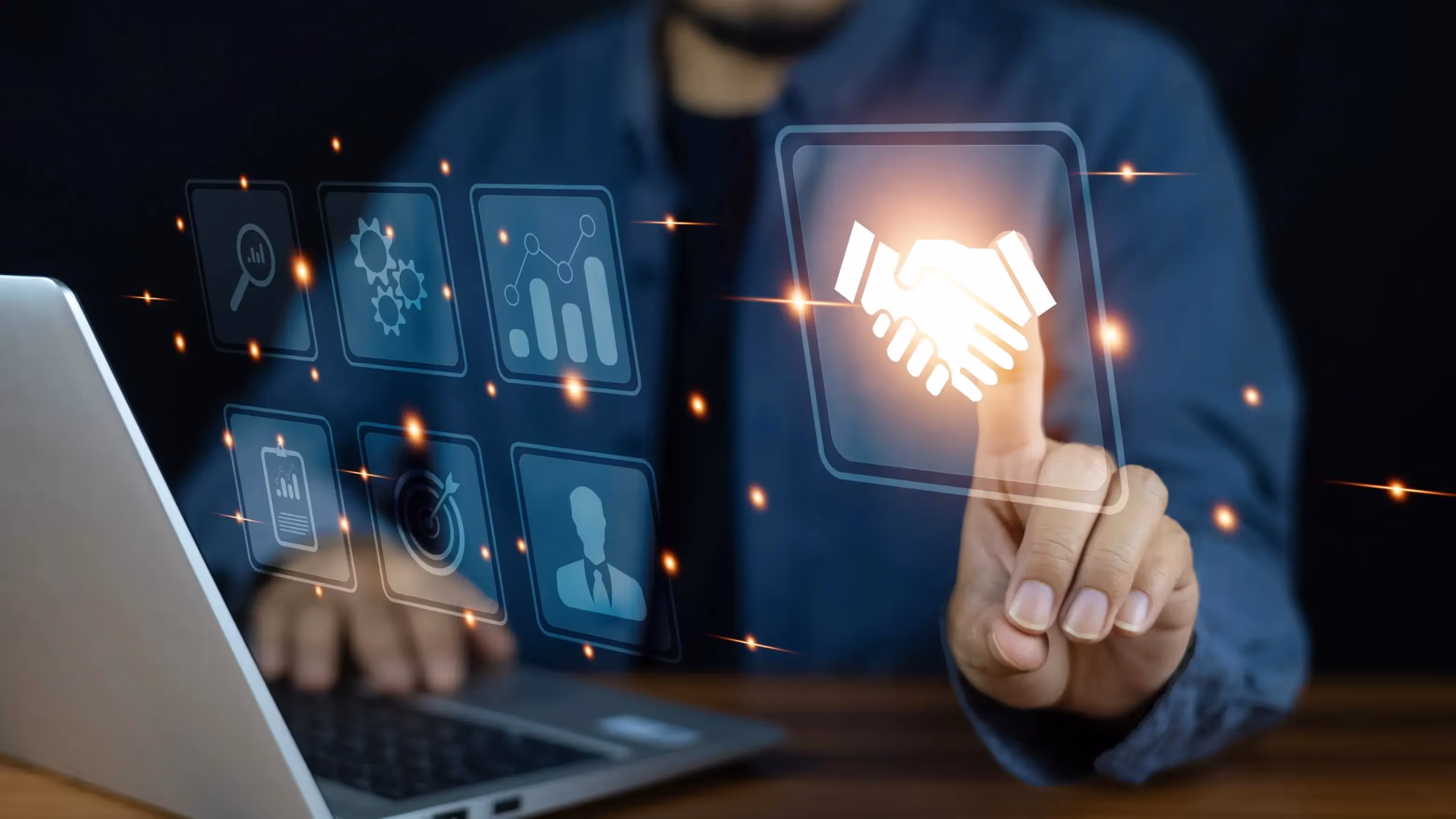 Businessman pressing digital handshake icon symbolizing referral program partnership and customer acquisition strategy through tech tools