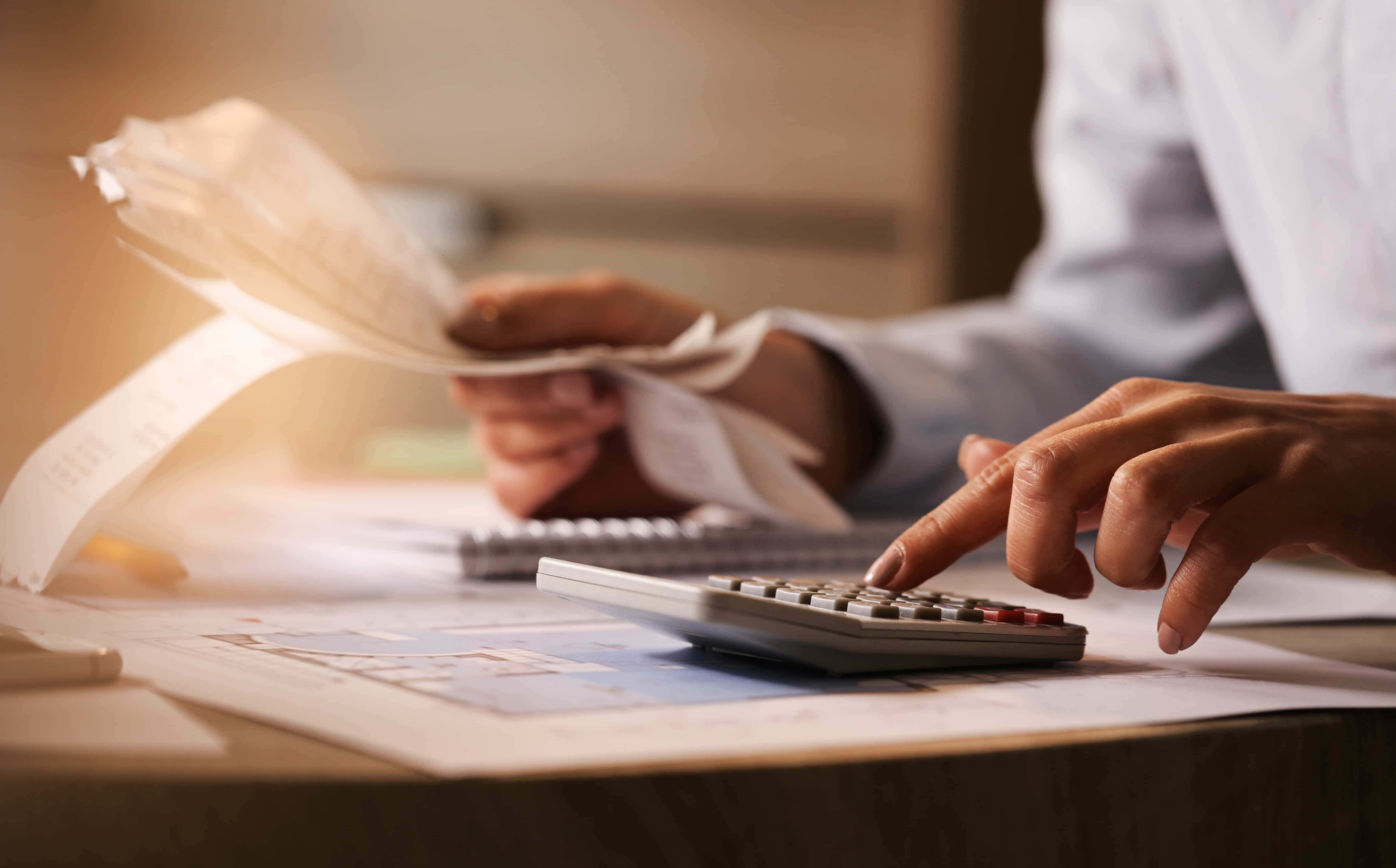 accountant using calculator