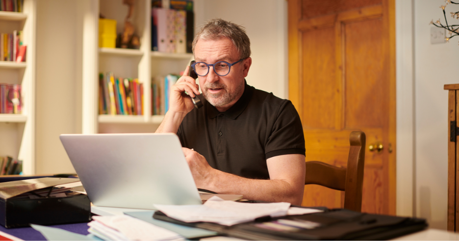 Man sitting at desk working on compuer