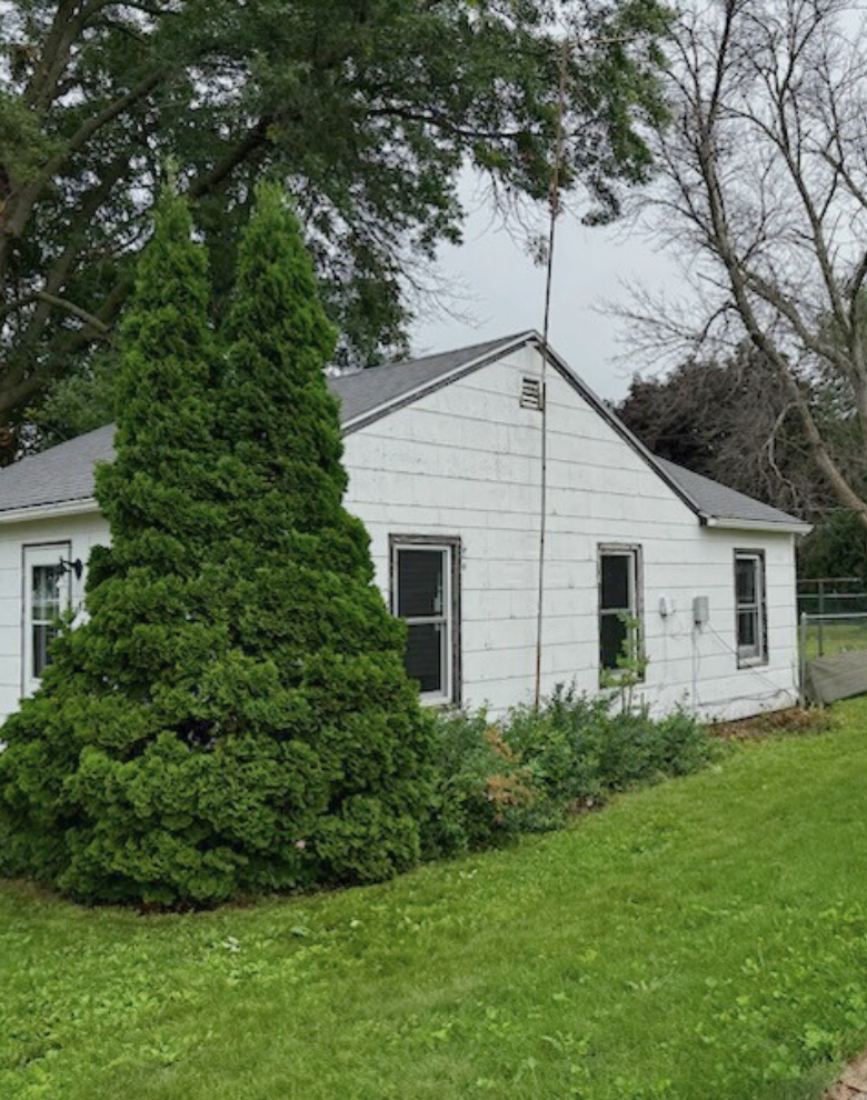 After image of a well trimmed house that was overgrown