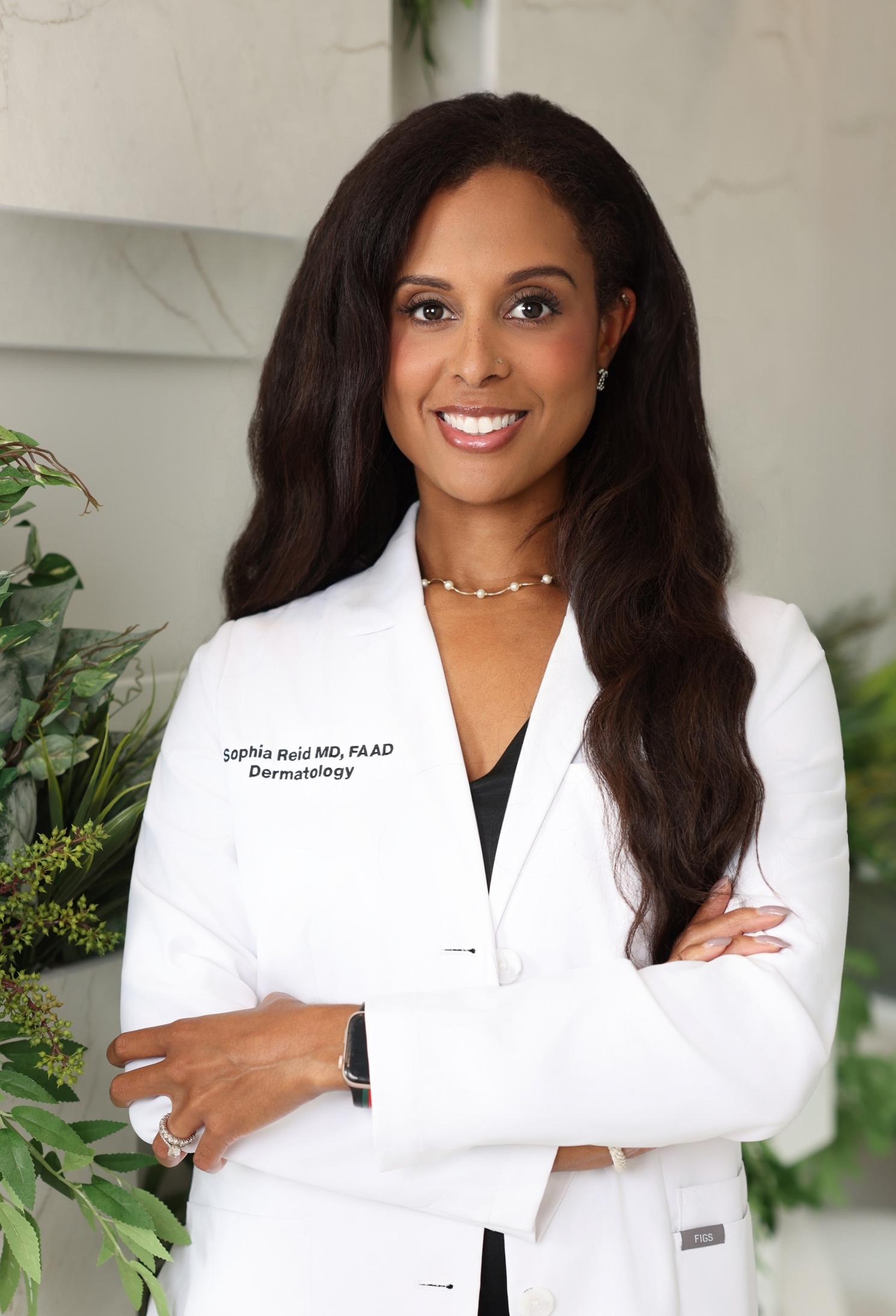4 women of varying skin tones smile and hug