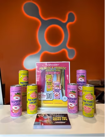 a group of cans of juice and a book