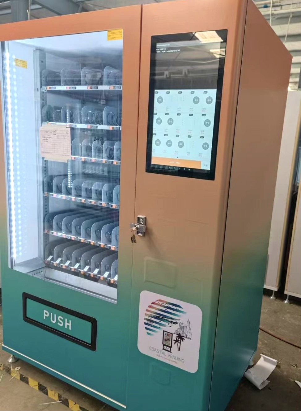 Coastal Vending 5-foot 50-slot touchscreen vending machine with custom branded wrap